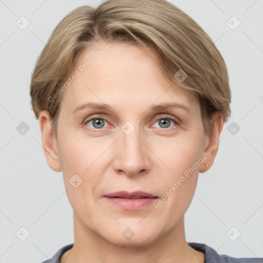 Joyful white adult female with short  brown hair and grey eyes