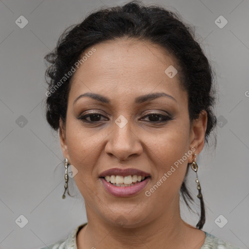 Joyful latino adult female with medium  brown hair and brown eyes
