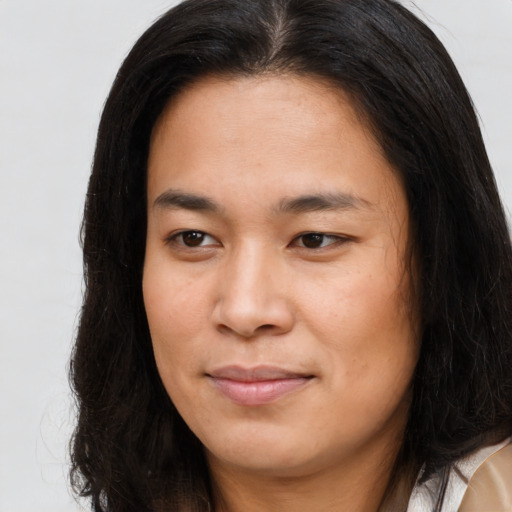 Joyful asian young-adult female with long  brown hair and brown eyes