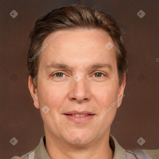 Joyful white adult male with short  brown hair and grey eyes