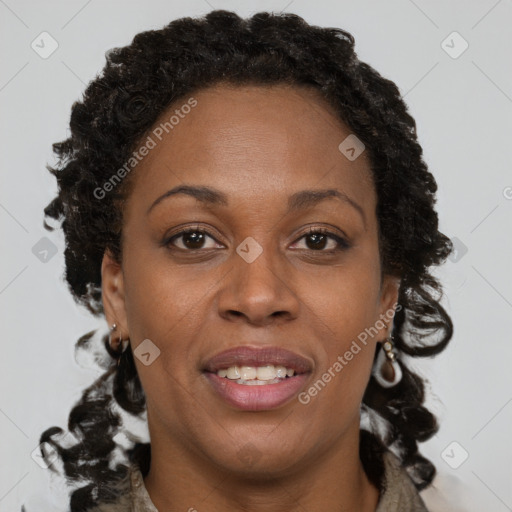 Joyful black young-adult female with long  brown hair and brown eyes