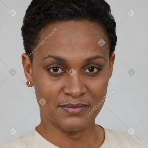 Joyful black young-adult female with short  brown hair and brown eyes