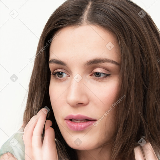 Neutral white young-adult female with long  brown hair and brown eyes