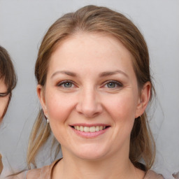 Joyful white young-adult female with medium  brown hair and brown eyes