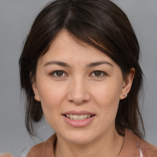 Joyful white young-adult female with medium  brown hair and brown eyes