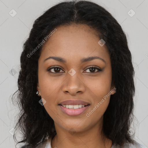 Joyful black young-adult female with long  brown hair and brown eyes