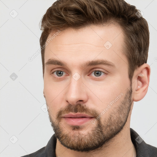 Neutral white young-adult male with short  brown hair and grey eyes