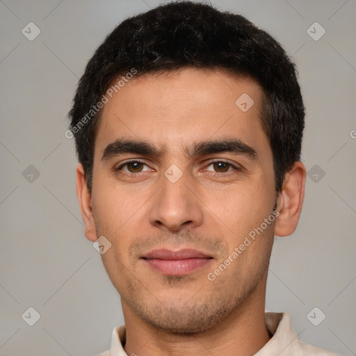 Joyful white young-adult male with short  black hair and brown eyes