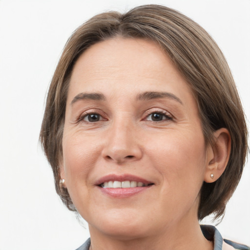 Joyful white adult female with medium  brown hair and grey eyes