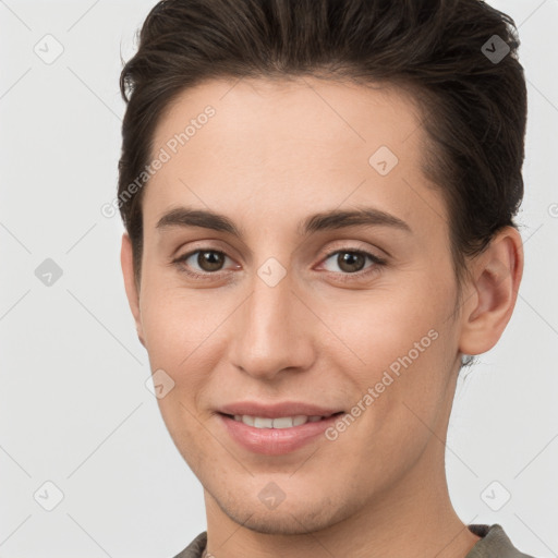 Joyful white young-adult female with short  brown hair and brown eyes