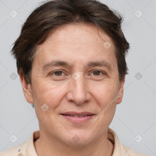 Joyful white adult female with short  brown hair and brown eyes