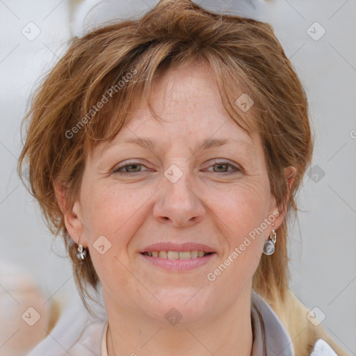 Joyful white adult female with medium  brown hair and blue eyes