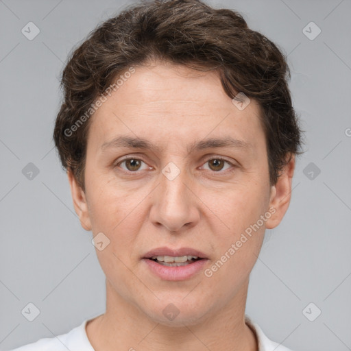 Joyful white adult female with short  brown hair and brown eyes