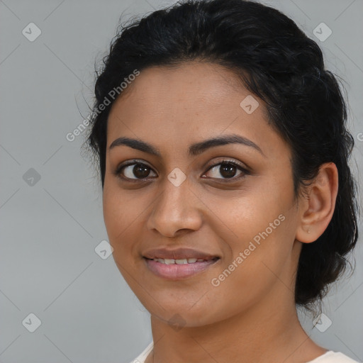 Joyful latino young-adult female with medium  black hair and brown eyes