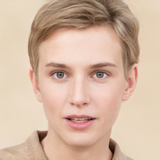 Joyful white young-adult female with short  brown hair and grey eyes