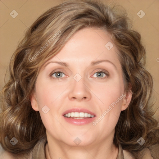 Joyful white adult female with medium  brown hair and blue eyes