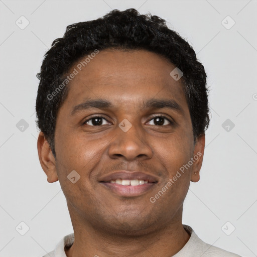 Joyful black young-adult male with short  brown hair and brown eyes