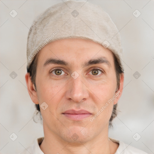 Joyful white adult male with short  brown hair and brown eyes