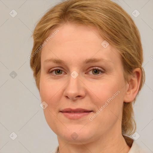 Joyful white adult female with medium  brown hair and blue eyes