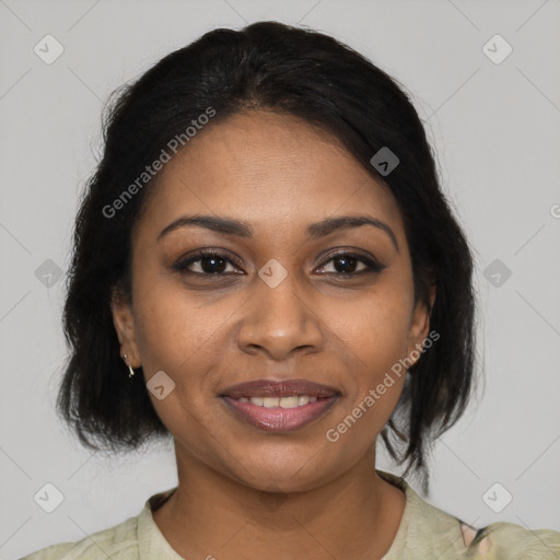 Joyful black young-adult female with medium  brown hair and brown eyes