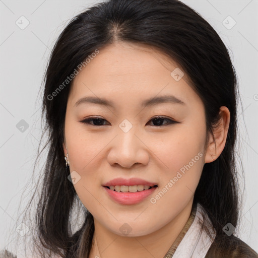 Joyful asian young-adult female with long  brown hair and brown eyes