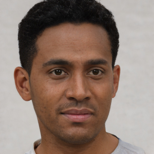 Neutral latino young-adult male with short  brown hair and brown eyes