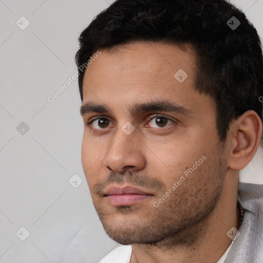 Neutral white young-adult male with short  black hair and brown eyes