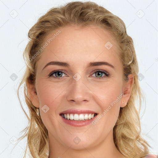 Joyful white young-adult female with long  brown hair and blue eyes