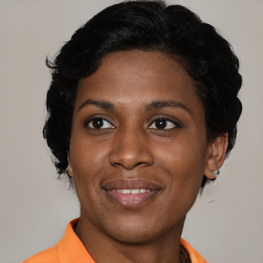 Joyful latino young-adult female with short  black hair and brown eyes