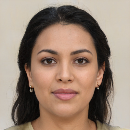 Joyful latino young-adult female with long  brown hair and brown eyes