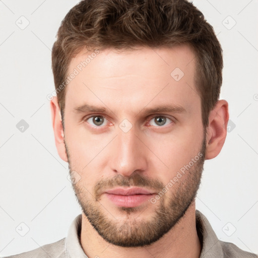 Neutral white young-adult male with short  brown hair and grey eyes