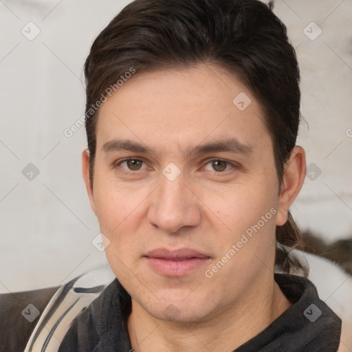 Joyful white adult male with short  brown hair and brown eyes