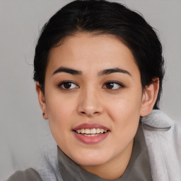 Joyful asian young-adult female with medium  black hair and brown eyes