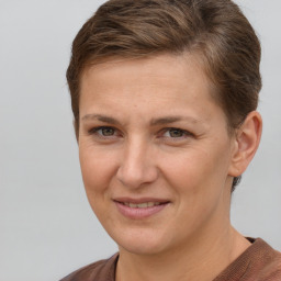 Joyful white adult female with short  brown hair and brown eyes