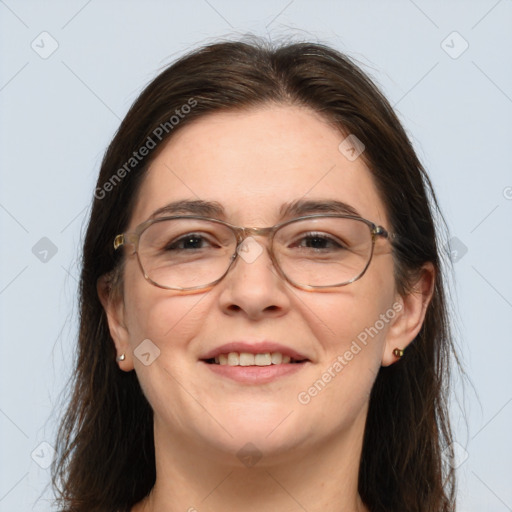 Joyful white adult female with long  brown hair and grey eyes