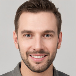 Joyful white young-adult male with short  brown hair and brown eyes