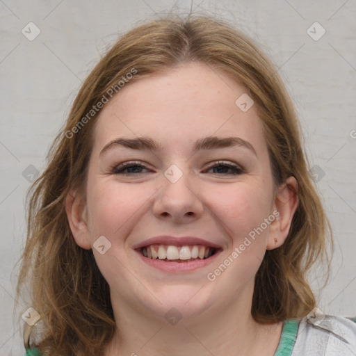 Joyful white young-adult female with medium  brown hair and blue eyes