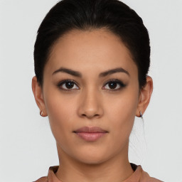 Neutral latino young-adult female with short  black hair and brown eyes