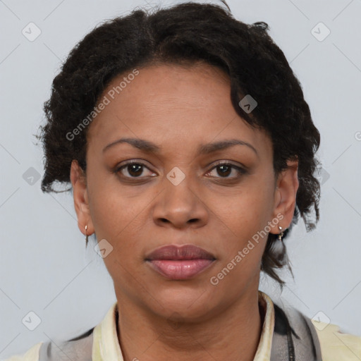 Joyful black adult female with short  brown hair and brown eyes