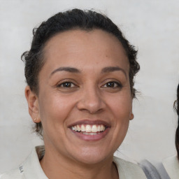 Joyful white adult female with short  brown hair and brown eyes