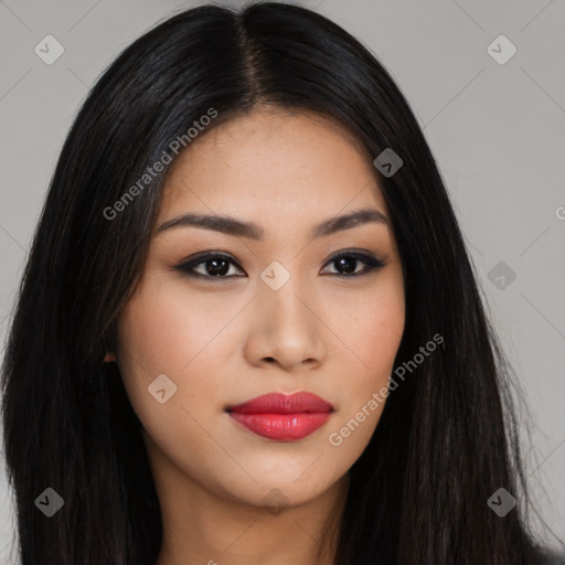 Joyful latino young-adult female with long  black hair and brown eyes