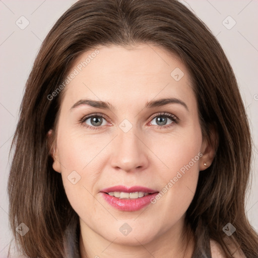 Joyful white young-adult female with long  brown hair and grey eyes