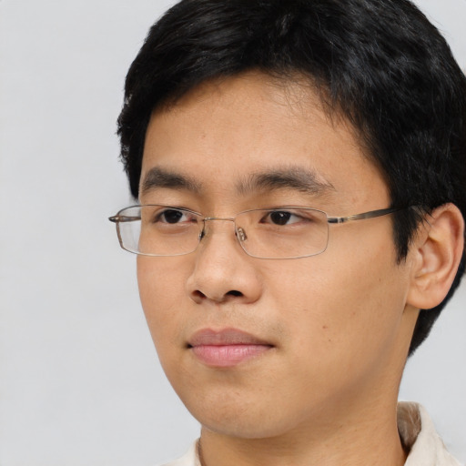 Neutral asian young-adult male with short  black hair and brown eyes