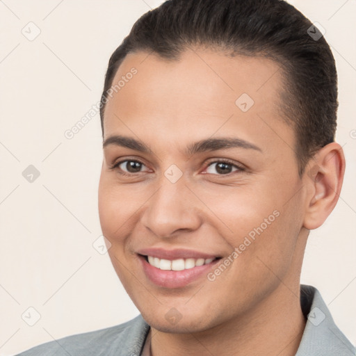 Joyful white young-adult male with short  brown hair and brown eyes