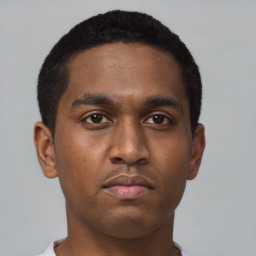 Neutral black young-adult male with short  black hair and brown eyes