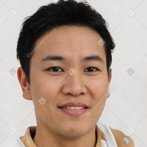 Joyful asian young-adult male with short  brown hair and brown eyes