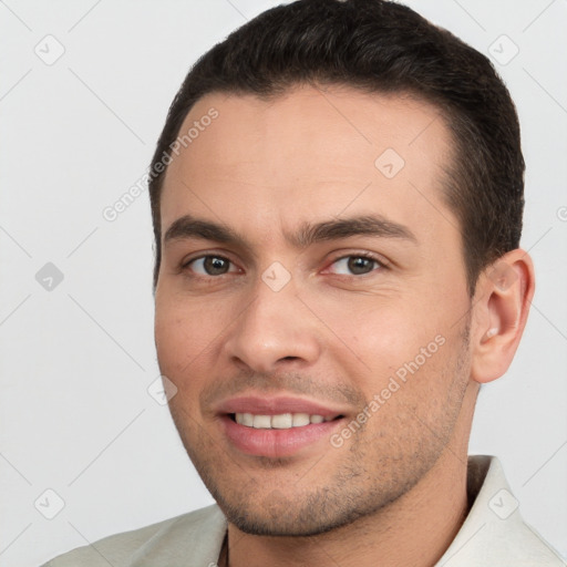 Joyful white young-adult male with short  brown hair and brown eyes