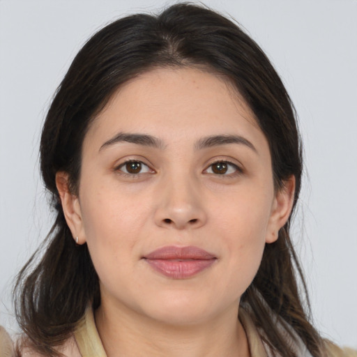 Joyful white young-adult female with medium  brown hair and brown eyes