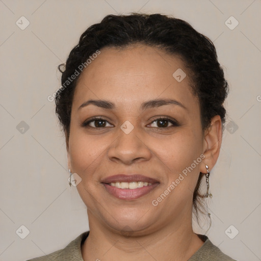 Joyful latino young-adult female with short  brown hair and brown eyes