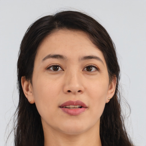 Joyful asian young-adult female with long  brown hair and brown eyes